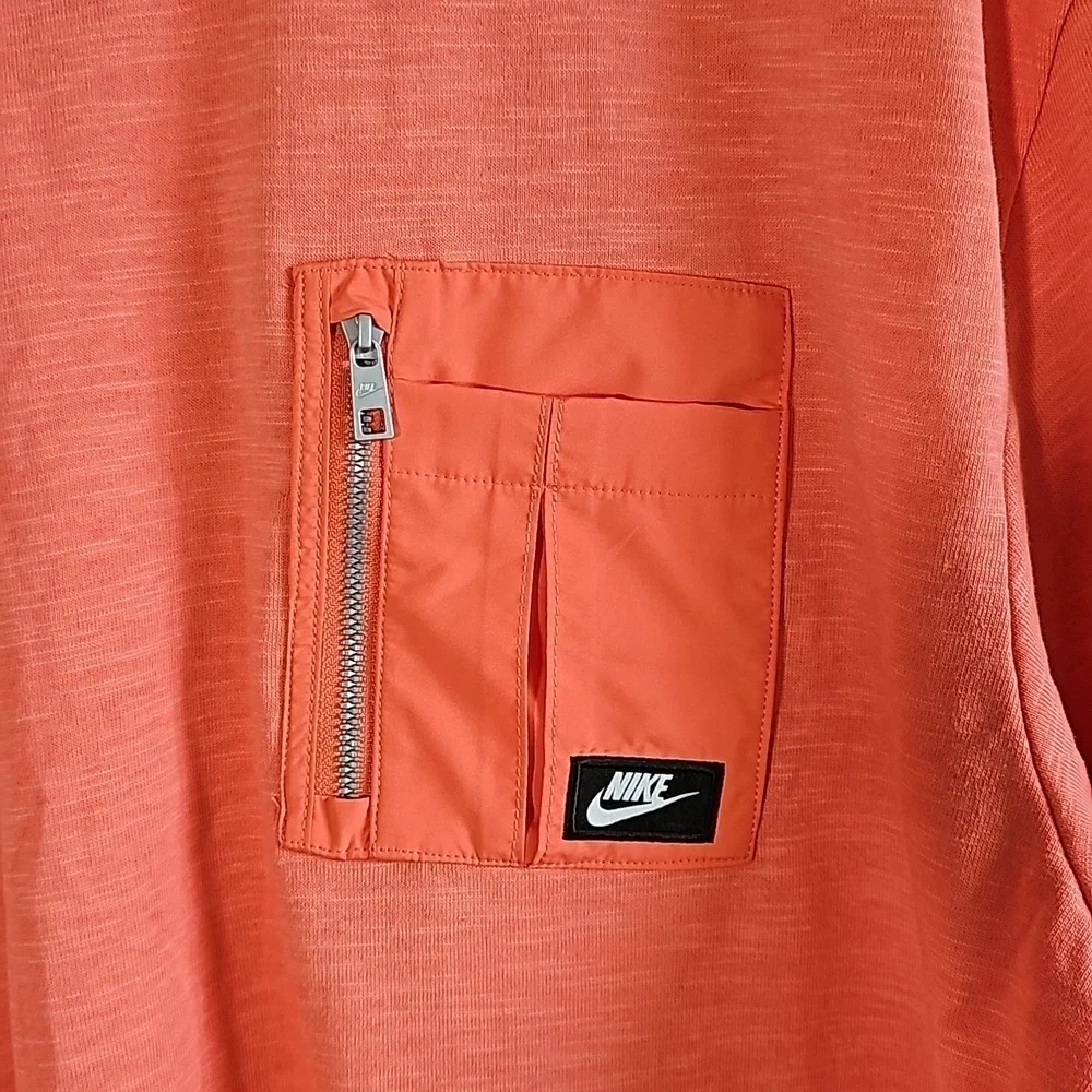 Nike Zip Pocket T-Shirt.